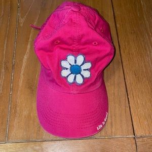 Life is Good baseball hat in hot pink with a daisy on the front.